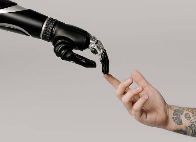 Bionic hand and human hand finger-pointing.