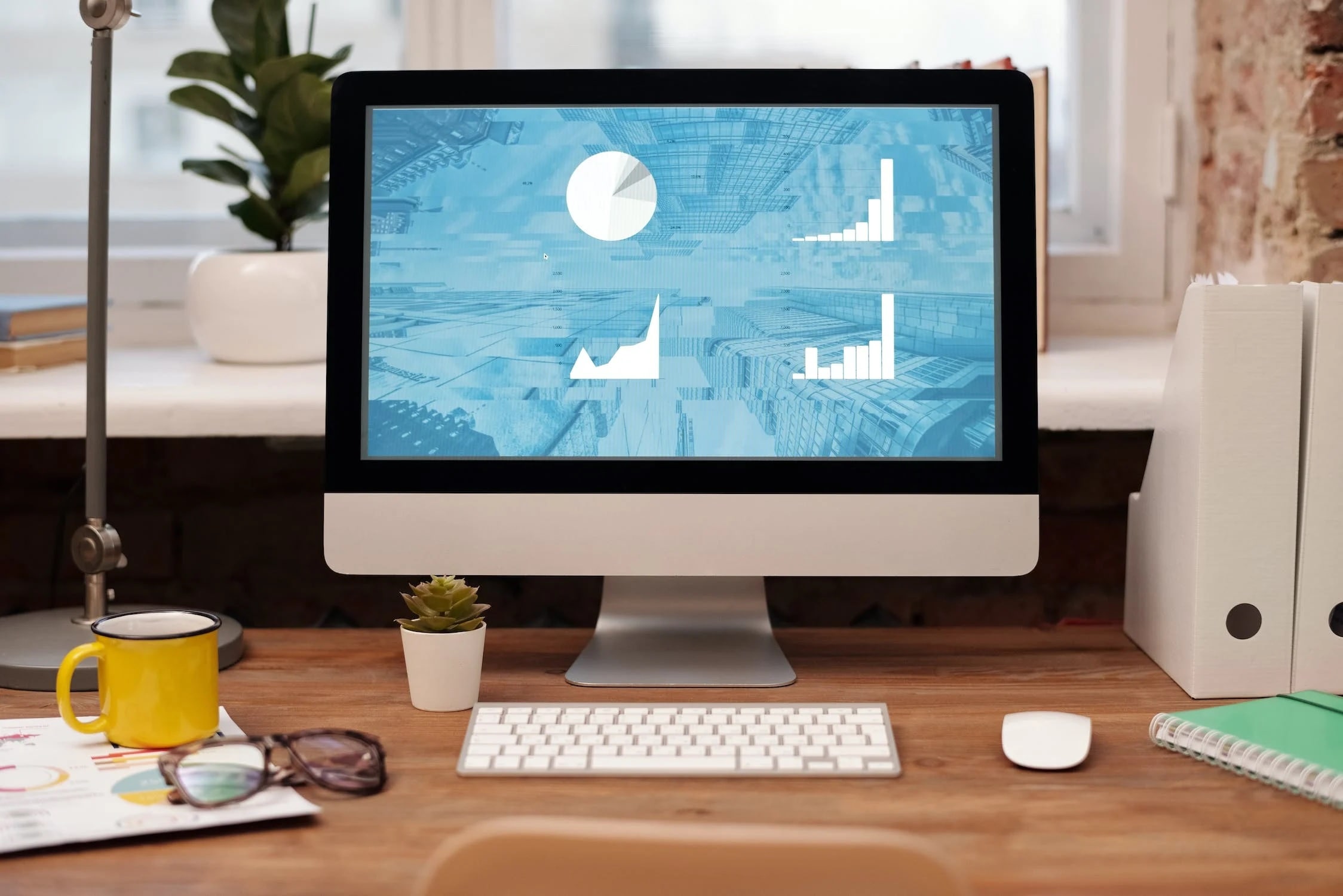 An illustration of a computer screen displaying graphs and pie charts.