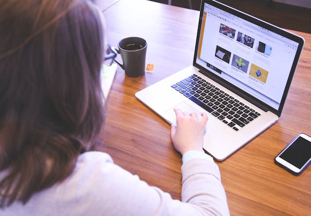 A woman browsing on her computer