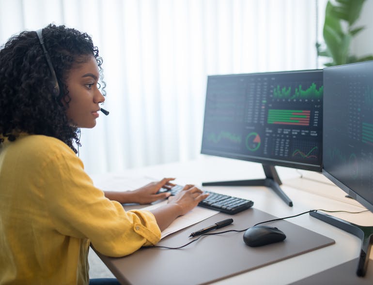 a woman analyzing data on her laptop